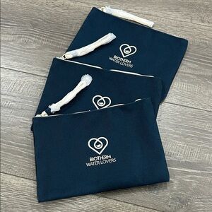 3/$15 Biotherm Navy wristlets Pouches Set